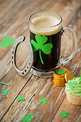 Image showing shamrock on glass of beer, horseshoe and coins