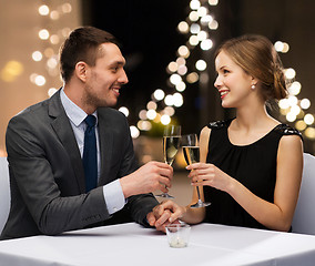 Image showing couple with glasses of champagne at restaurant