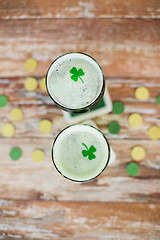 Image showing glasses of green beer with shamrock from top