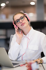 Image showing businesswoman using a laptop in startup office