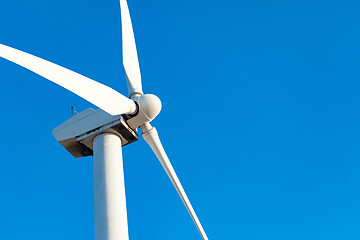 Image showing Single Wind Turbine Over Dramatic Blue Sky