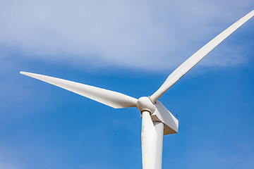 Image showing Single Wind Turbine Over Dramatic Blue Sky