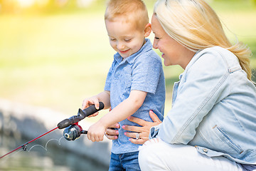 Image showing Young Caucasian Mother and Son Having Fun Fishing At The Lake