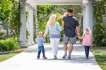 Image showing Young Caucasian Family Taking A Walk In The Park