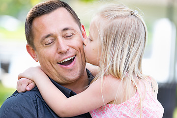 Image showing Young Caucasian Father and Daughter Having Fun At The Park