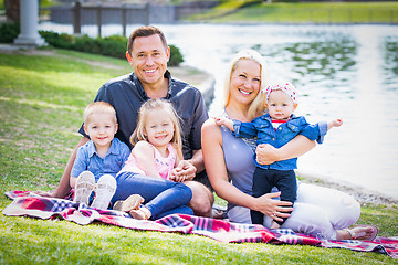 Image showing Happy Young Caucasian Family Portrait In The Park