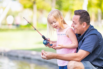 Image showing Young Caucasian Father and Daughter Having Fun Fishing At The La