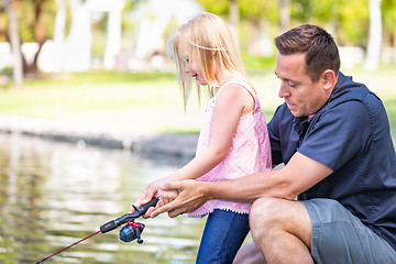 Image showing Young Caucasian Father and Daughter Having Fun Fishing At The La