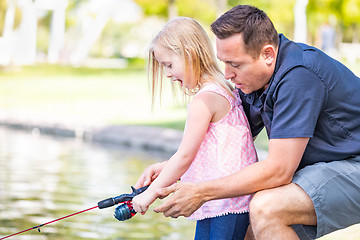 Image showing Young Caucasian Father and Daughter Having Fun Fishing At The La