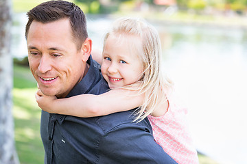 Image showing Young Caucasian Father and Daughter Having Fun At The Park