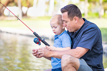 Image showing Young Caucasian Father and Son Having Fun Fishing At The Lake