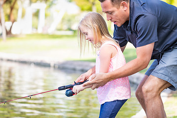 Image showing Young Caucasian Father and Daughter Having Fun Fishing At The La