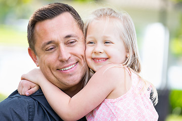 Image showing Young Caucasian Father and Daughter Having Fun At The Park