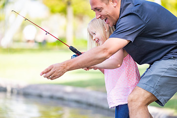 Image showing Young Caucasian Father and Daughter Having Fun Fishing At The La