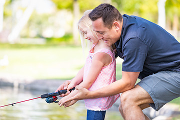 Image showing Young Caucasian Father and Daughter Having Fun Fishing At The La