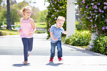 Image showing Young Sister and Brother Having Fun Running At The Park