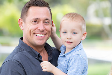 Image showing Young Caucasian Father and Son Having Fun At The Park