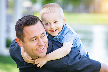 Image showing Young Caucasian Father and Son Having Fun At The Park