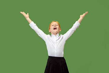 Image showing Winning success teen girl happy ecstatic celebrating being a winner. Dynamic energetic image of female model