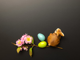 Image showing a happy easter decoration with a bunny eggs and blossoms