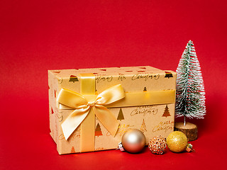 Image showing Christmas decoration gift box with red background