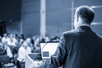 Image showing Public speaker giving talk at business event.