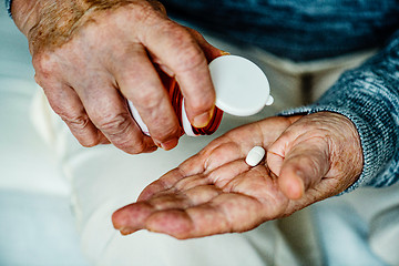 Image showing taking a tablet