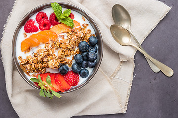 Image showing Yogurt with baked granola and berries