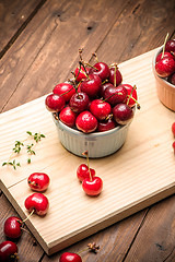 Image showing Red ripe cherries in ceramic bowls