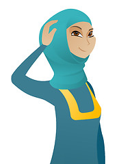 Image showing Young muslim business woman scratching her head.