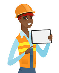 Image showing Young african builder holding tablet computer.