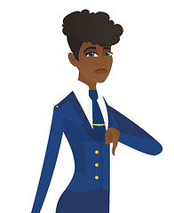 Image showing Disappointed african stewardess with thumb down.