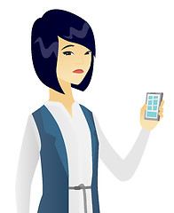 Image showing Disappointed asian business woman with cellphone.