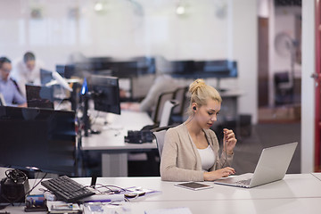 Image showing businesswoman using a laptop in startup office