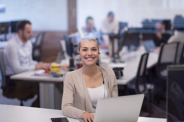 Image showing businesswoman using a laptop in startup office