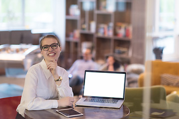 Image showing businesswoman using a laptop in startup office