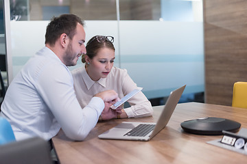 Image showing Business People Working With Tablet in startup office