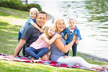 Image showing Happy Young Caucasian Family Portrait In The Park