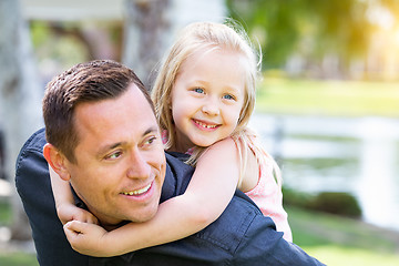 Image showing Young Caucasian Father and Daughter Having Fun At The Park