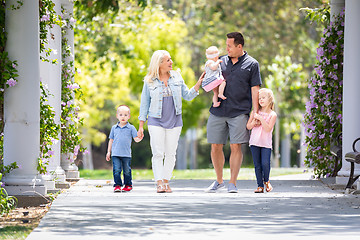 Image showing Young Caucasian Family Taking A Walk In The Park