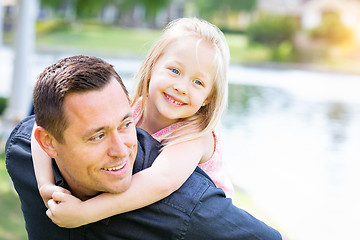 Image showing Young Caucasian Father and Daughter Having Fun At The Park