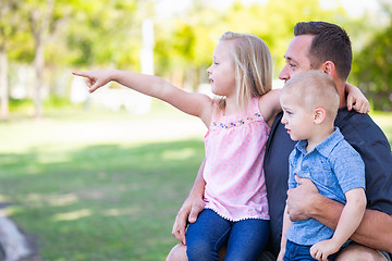 Image showing Young Caucasian Dad, Son and Daughter Having Fun In The Park