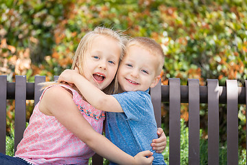 Image showing Young Sister and Brother Having Fun On The Bench At The Park