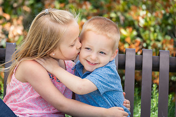 Image showing Young Sister and Brother Having Fun On The Bench At The Park