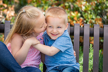 Image showing Young Sister and Brother Having Fun On The Bench At The Park