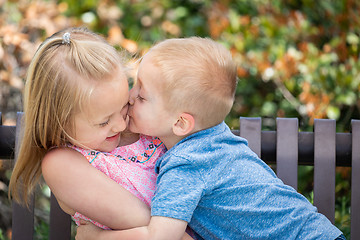 Image showing Young Sister and Brother Having Fun On The Bench At The Park