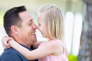 Image showing Young Caucasian Father and Daughter Having Fun At The Park