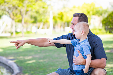 Image showing Young Caucasian Father and Son Having Fun At The Park