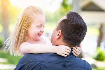 Image showing Young Caucasian Father and Daughter Having Fun At The Park