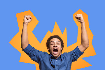 Image showing Winning success man happy ecstatic celebrating being a winner. Dynamic energetic image of male model